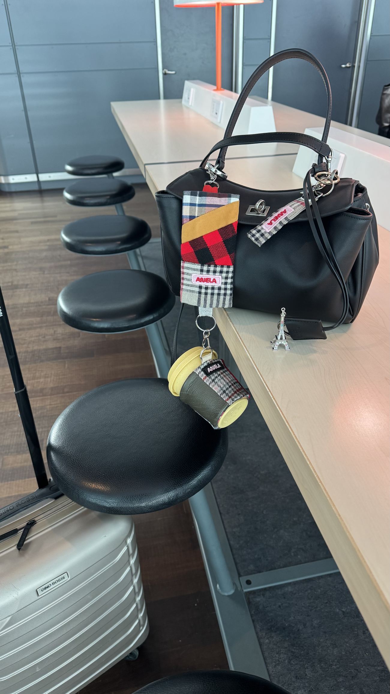 ANELA pouch and keychain at the airport